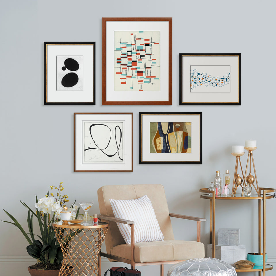 How to hang art. Image of a wall of art with each piece perfectly selected and hung. Photo accompanies link to Martha Stewart article.